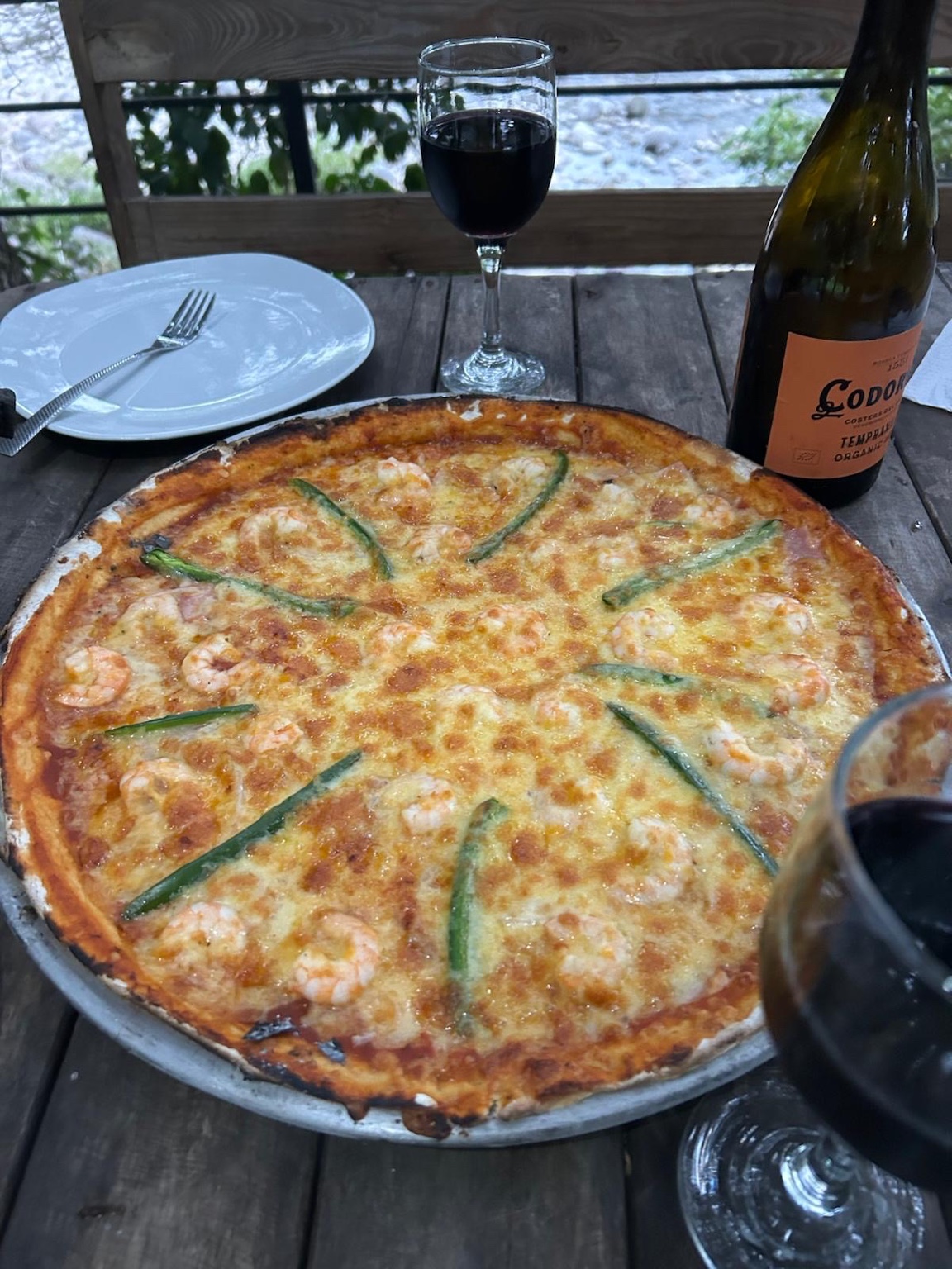 Pizza con vista al río